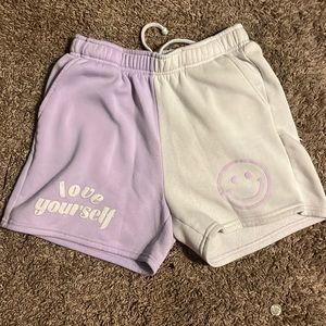these purple and white shorts are from no boundaries and are a small